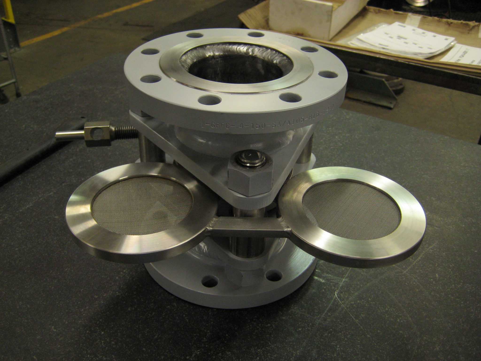 Cam-set equipped with strainers The SchuF Cam-Set line blind can be modified to include orifice plates, strainers (shown) or rupture discs. When the in-line addition needs to be replaced the blind can quickly be swung to replace the worn out plate.